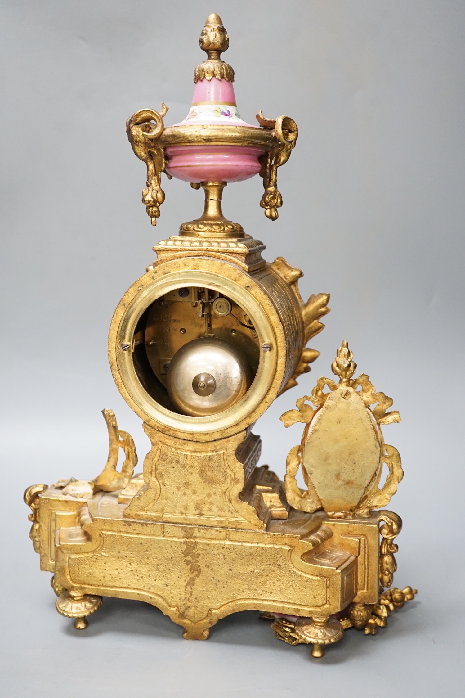 A French gilt metal and porcelain clock garniture. 36.5cm